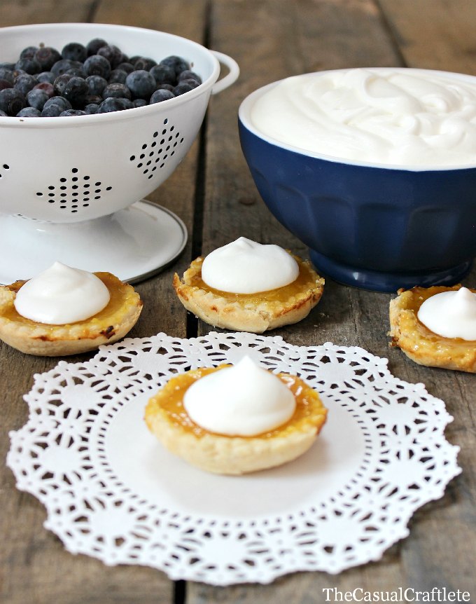 Mini Lemon Tarts with fresh blueberries and whipped cream