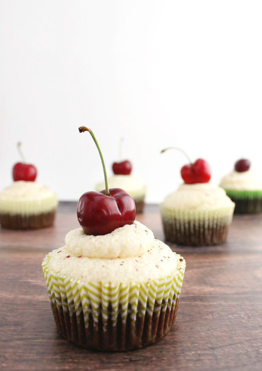 Delicious dark chocolate cupcakes with a rich cherry filling and white chocolate frosting!