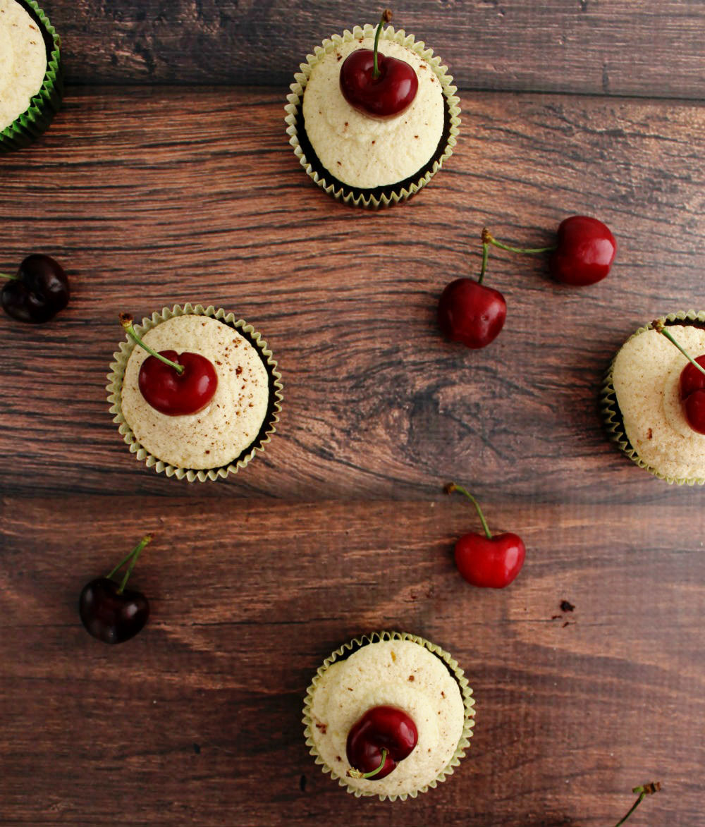 Delicious dark chocolate cupcakes with a rich cherry filling and white chocolate frosting!