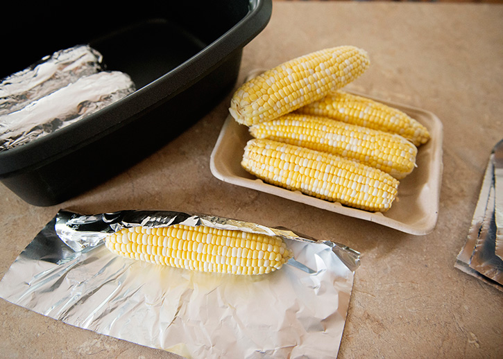 This slow cooker corn on the cob is the easiest way to cook corn. Keep your kitchen cool by cooking large amounts of corn in the slow cooker all summer long.