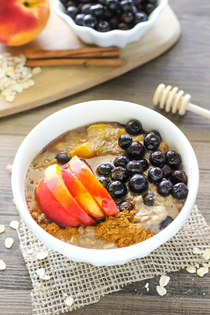 Blueberry Peach Oatmeal - a delicious oatmeal recipe made with freshly picked blueberries and peaches. Great for quick breakfasts on the go!