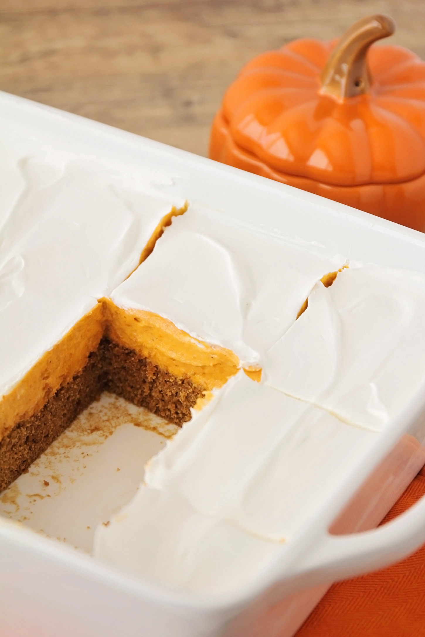 Delicious layers of soft gingerbread cake, creamy pumpkin filling and light whipped topping in an easy to make fall dessert.
