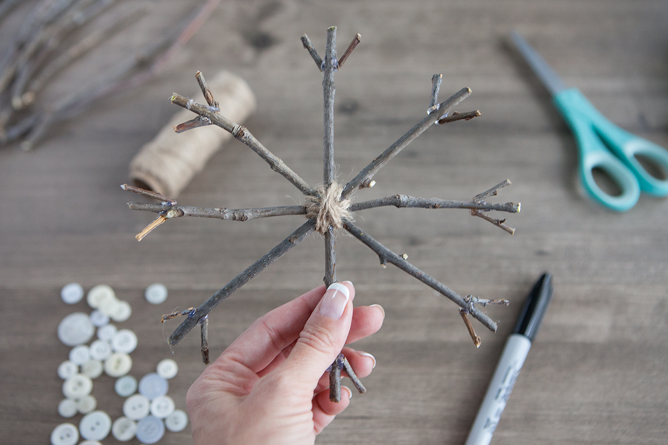 Bring a touch of nature indoors this year as you decorate your tree – learn how to make rustic twig Christmas ornaments! They're simple, insanely inexpensive and look beautiful!