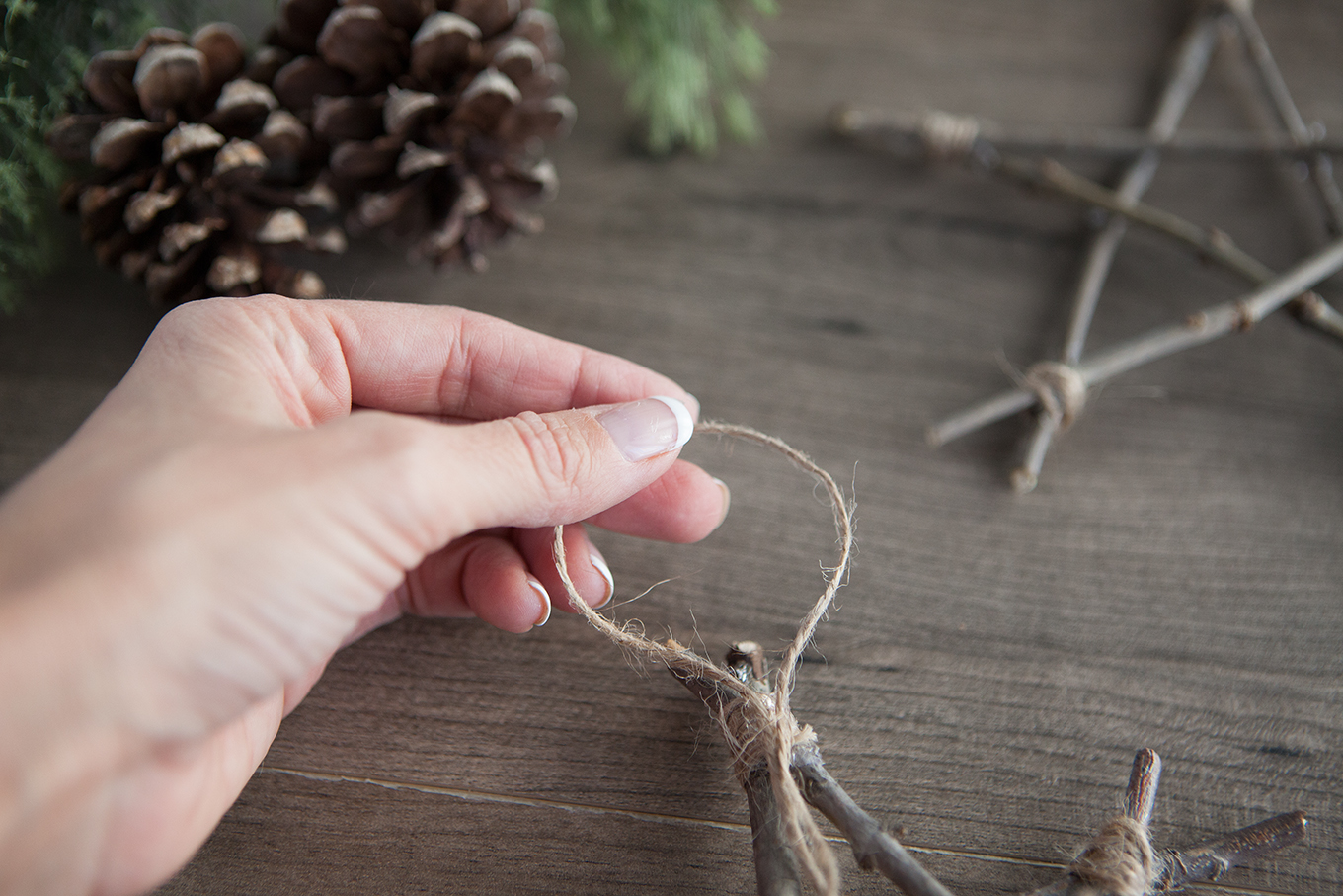 Bring a touch of nature indoors this year as you decorate your tree – learn how to make rustic twig Christmas ornaments! They're simple, inexpensive and look beautiful!