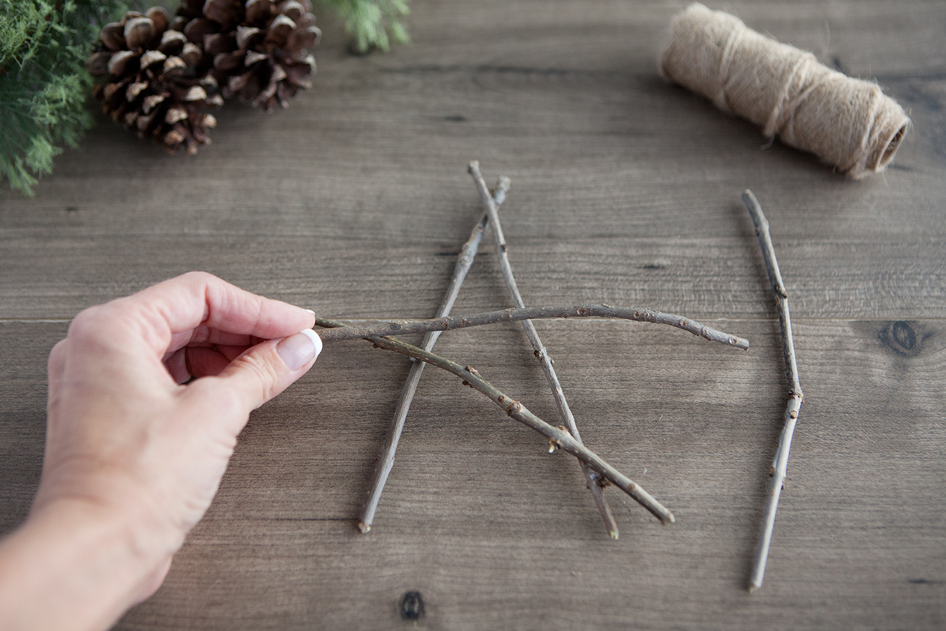 Bring a touch of nature indoors this year as you decorate your tree – learn how to make rustic twig Christmas ornaments! They're simple, inexpensive and look beautiful!