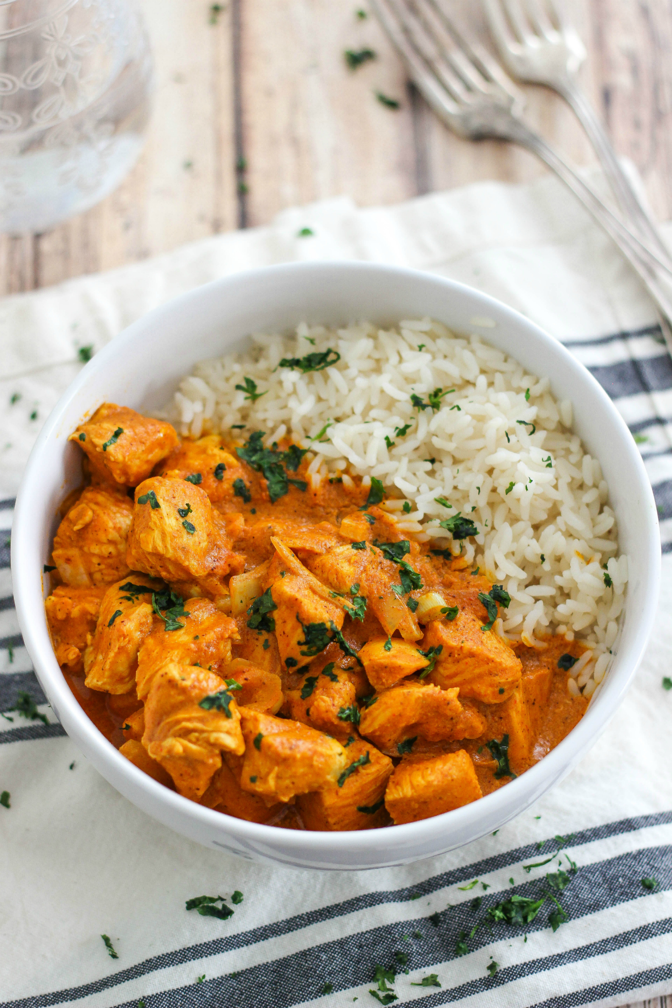 Easy Slow Cooker Butter Chicken is a flavorful Indian chicken dish cooked in a coconut curry sauce and served with rice. This is a simple weeknight meal.