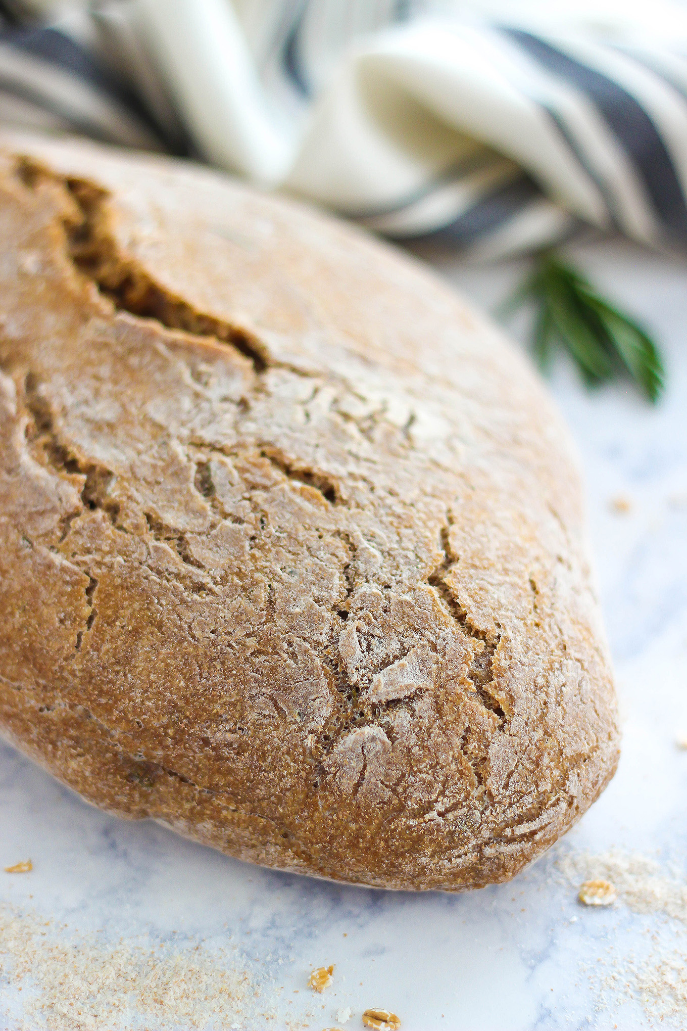 This No-Knead Whole Wheat Rosemary Bread is the perfect recipe for beginners. Enjoy a hearty and healthy loaf of bread with just a few steps and a simple list of ingredients.