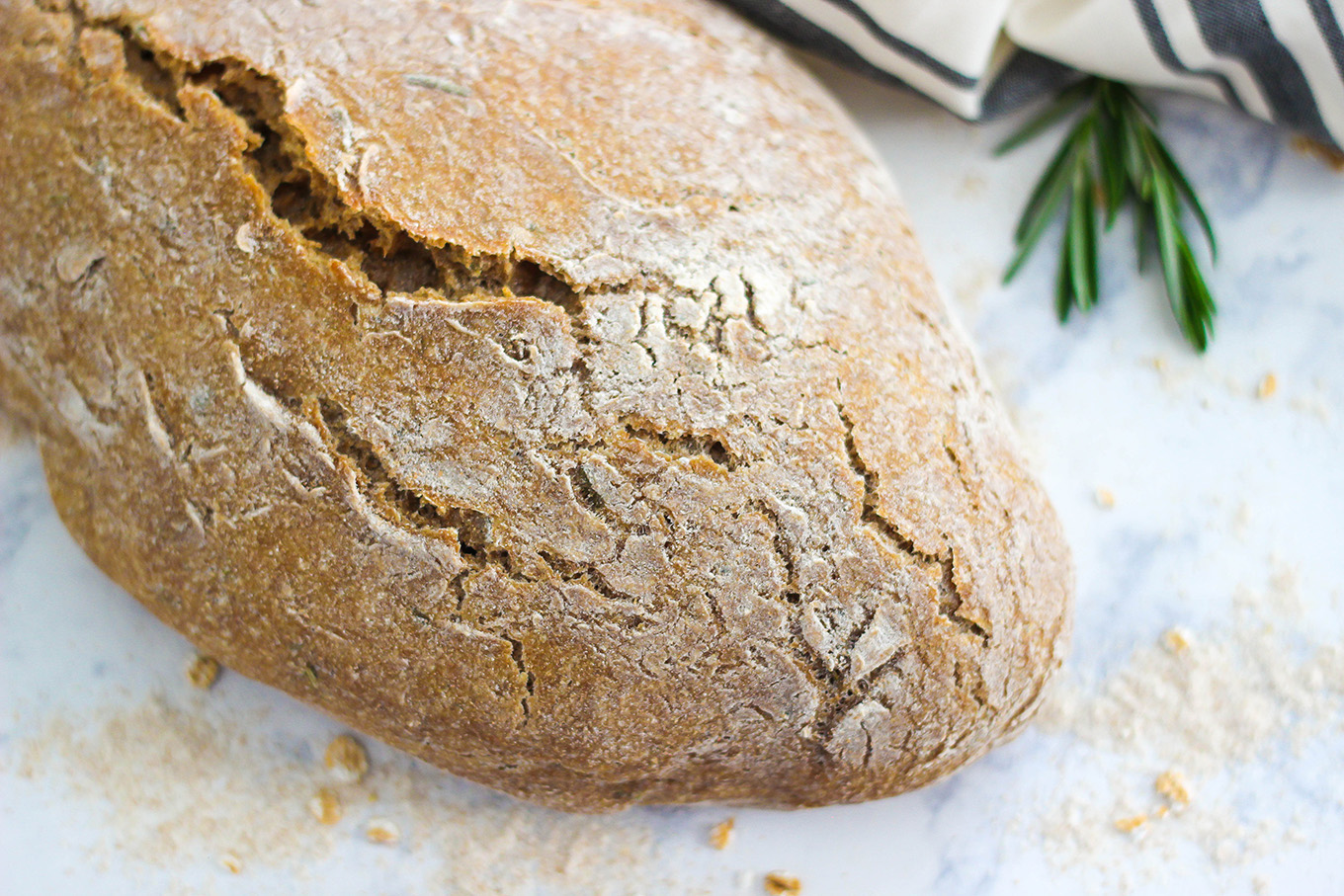 This No-Knead Whole Wheat Rosemary Bread is the perfect recipe for beginners. Enjoy a hearty and healthy loaf of bread with just a few steps and a simple list of ingredients.