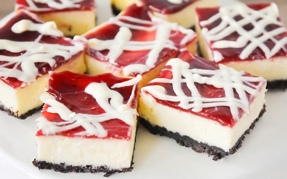 These White Chocolate Raspberry Cheesecake Bars don't just look fancy they taste fancy too! The white chocolate and raspberry flavors paired with a homemade oreo crust make them hard to resist.
