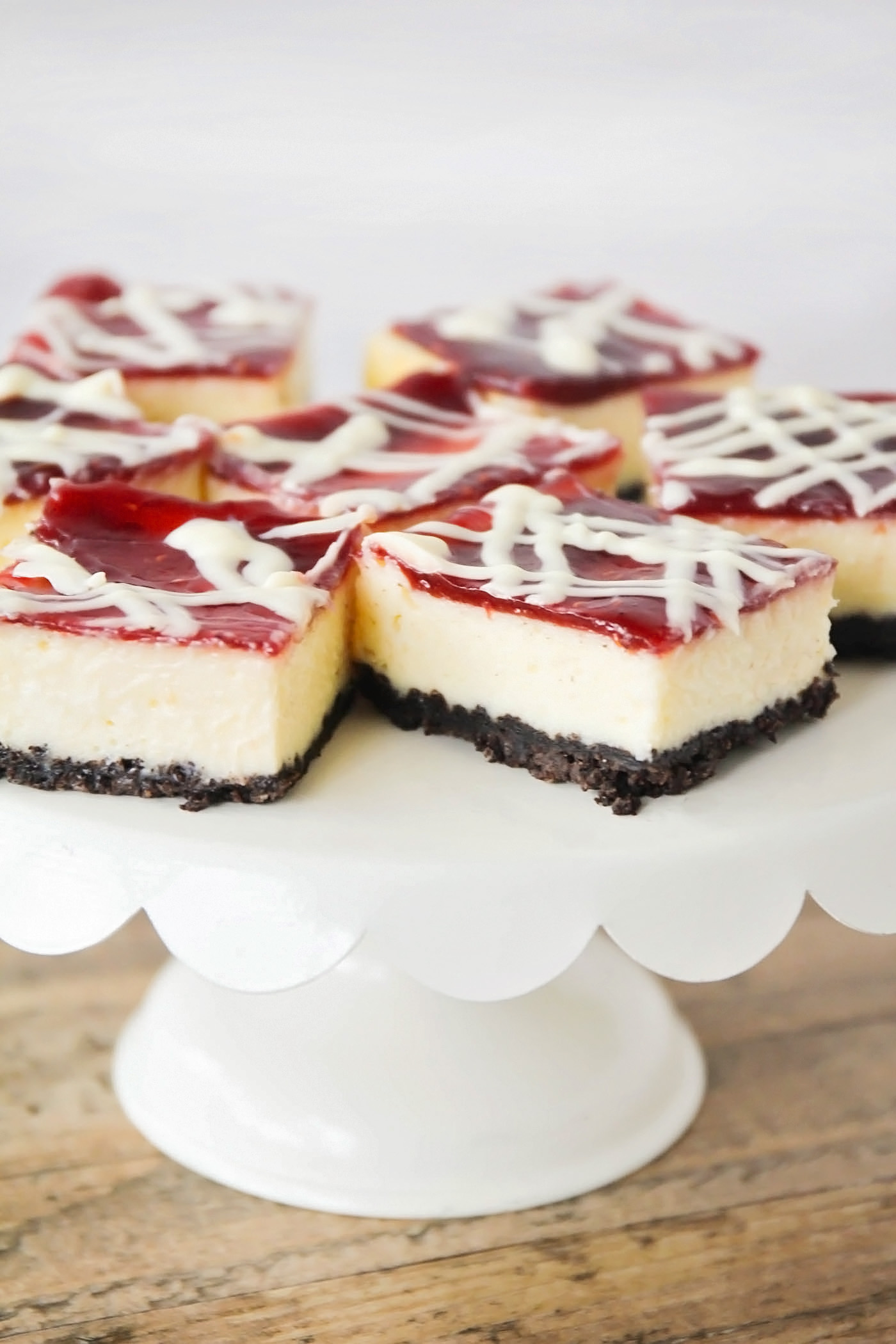 These White Chocolate Raspberry Cheesecake Bars may look fancy but they're easy to make! The rich flavors and homemade oreo crust make them hard to resist.